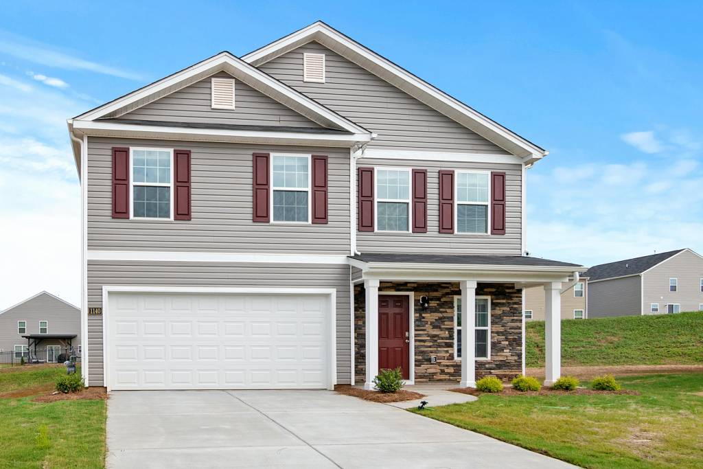 two story house with a new garage door